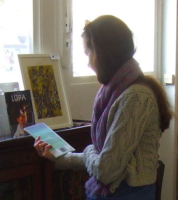 A visitor checking out books at 'Reading Corner'.